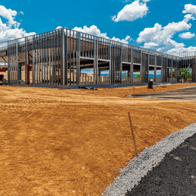 Commercial building framed on a graded development site