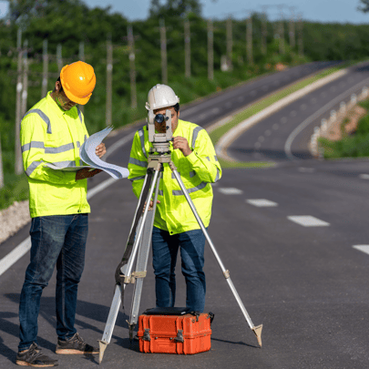 Surveyors measuring a newly built road